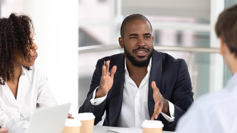 Young professional in a meeting discussing leadership in project management