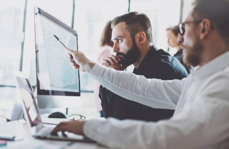 Two team members using hybrid agile on a project