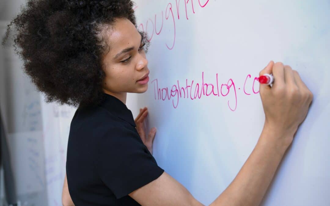 African American women writing on a white board