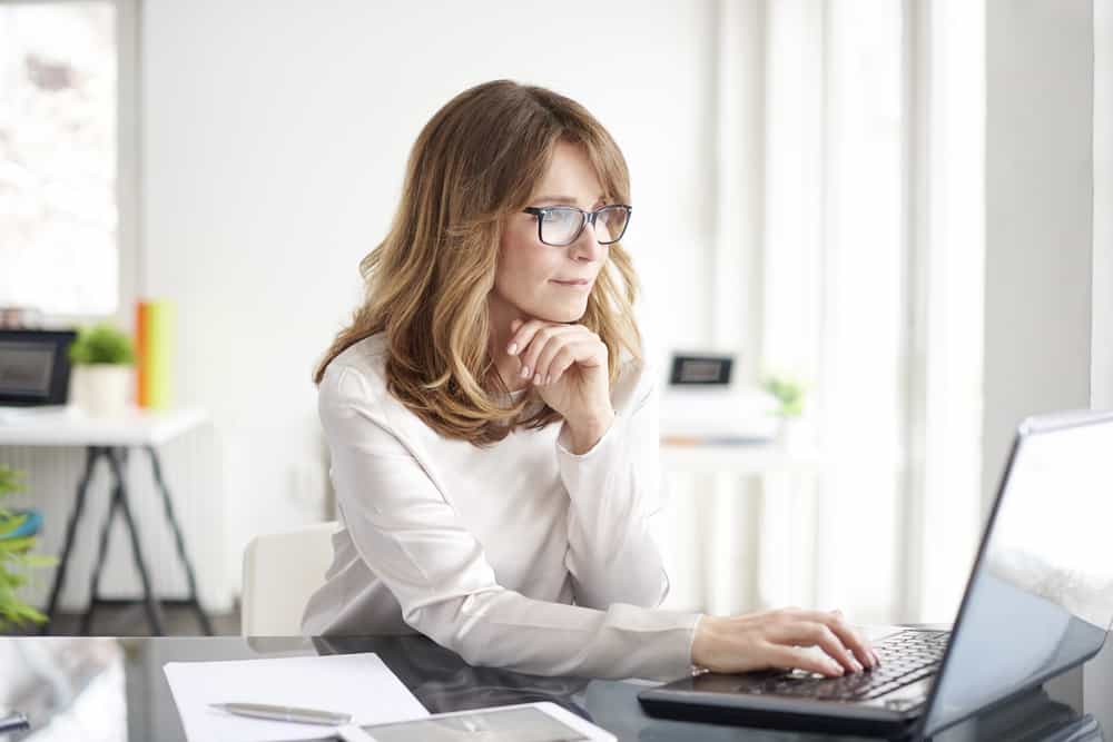 Woman on computer using PMP eLearning course