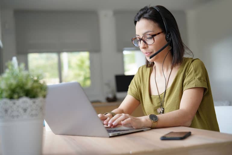 Woman on computer using PMP eLearning course